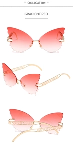 Detail of gradient red butterfly wing sunglasses with hollowed metal temples and hinges