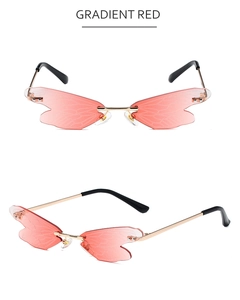 Macro detail of gradient red dragonfly wing lenses with bionic veins and gold metal frame