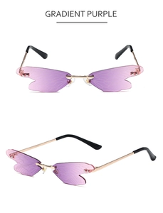 Close-up of purple gradient dragonfly wing lenses and gold metal frame detailing
