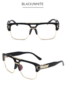 Detail view of fashion square glasses with black and gold frames and textured hinges
