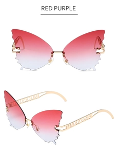 Detail of red-purple gradient butterfly rimless sunglasses with gold metal temples
