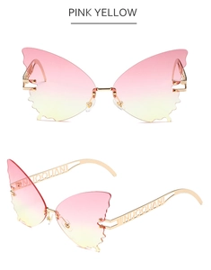 Detail of pink-yellow gradient butterfly sunglasses with gold hollow metal temples