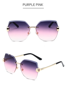 Details einer randlosen Polygon-Sonnenbrille mit lila-rosa Verlauf und goldenem Metallgestell