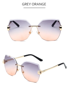 Detailansicht der randlosen geometrischen Sonnenbrille mit grau-orangefarbenen Gläsern