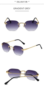 Close-up of rimless gradient grey sunglasses with textured gold metal temples and tips