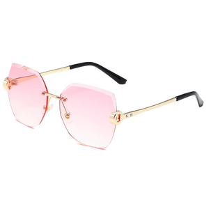 Moderne randlose Sonnenbrille mit rosa Verlaufsgläsern und goldenen Metallbügeln