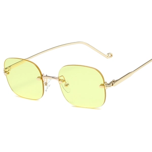 Lunettes de soleil carrées sans monture avec verres jaunes et branches dorées