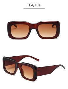 Detail view of tea-colored vintage rectangle sunglasses with thick frames and gradient lenses