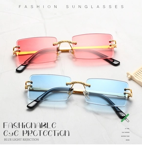 Detail of red and blue gradient rimless sunglasses with gold metal frames and nose bridge