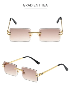 Detail view of rimless rectangle sunglasses with gradient tea lenses and golden metal temples