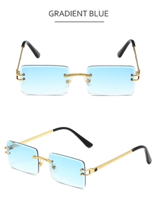 Detail view of rimless rectangle sunglasses with gradient blue lenses and gold metal temples