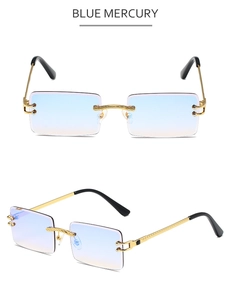 Detailed macro view of engraved gold bridge and gradient lenses on rimless sunglasses