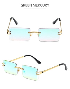 Detail view of rimless green mercury sunglasses with engraved gold metal temples