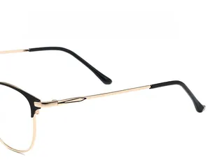 Close-up of semi-rimless eyeglass frames showing flexible metal temples and hinges