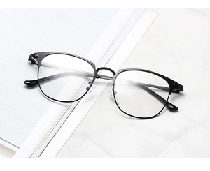 Close-up of black retro boston frames showing metal details and elegant nose pads