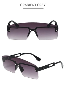 Detail of gradient grey oversized sunglasses with decorative rivets and hollow temples