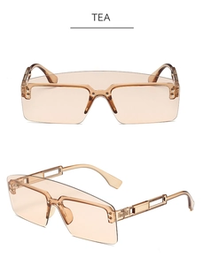 Close-up of tea-colored lenses and fashion flat top frame on oversized sunglasses