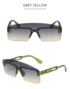 Detail view of transparent green sunglasses with grey yellow gradient lenses and rivets