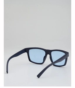 Detail view of the deep blue frame and translucent light blue lenses of these sport sunglasses