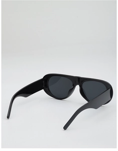 Detail view of black oversized pilot sunglasses with wide temples and lightweight frame
