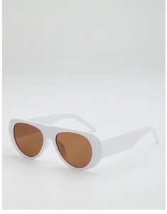 Detail view of bold white aviator sunglasses with brown lenses and chunky frame
