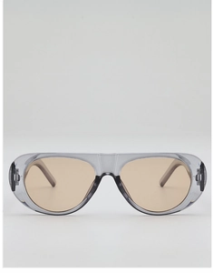 Close-up of translucent grey aviator sunglasses with light amber lenses for fashion