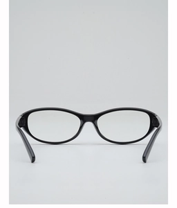 Gros plan d'une monture de lunettes ovale rétro en noir poli avec texture brillante