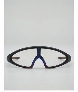 Close-up of futuristic oversized wrap-around sunglasses with matte black frames and clear lens