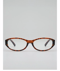 Détail de lunettes ovales rétro avec monture en acétate poli au motif tortue chic