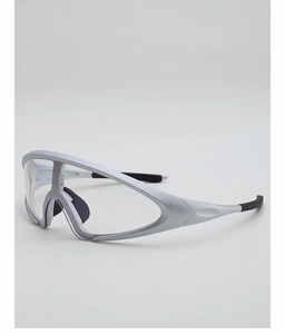 Detail of silver futuristic sports sunglasses featuring non-slip black temples and purple nose pads