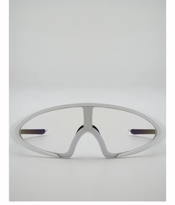 Detail view of white futuristic sports goggles with anti-slip nose pads and clear lenses