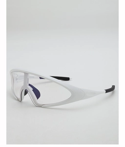 Macro view of white wrap-around cycling glasses with clear lenses and purple nose pads
