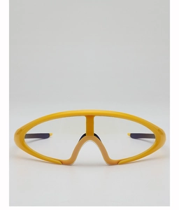 Front view of yellow futuristic sports goggles with streamlined wrap-around frame