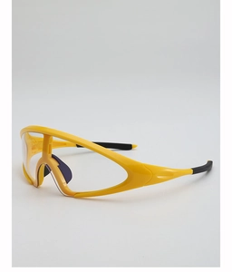 Side view of yellow aerodynamic sports sunglasses featuring clear protective lenses