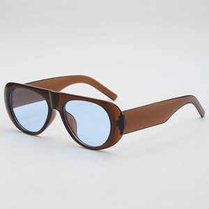 Retro pilot sunglasses with translucent brown frames and light blue lenses in a 45-degree view