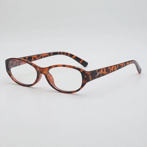 Monture de lunettes ovale rétro en écaille de tortue avec détails métalliques, vue de dessus