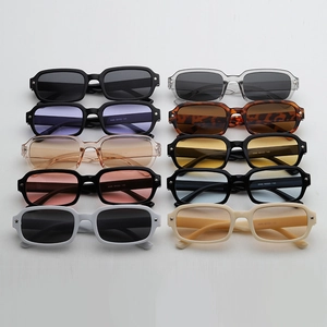 Flat lay of retro square sunglasses in jelly colors with star metal accents on the frames
