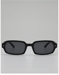 Detail of black rectangular sunglasses featuring silver star studs on the frame edges