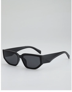 Vue détaillée de lunettes de soleil vintage œil-de-chat noires à monture épaisse