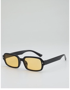 Detail of black frame sunglasses with yellow lenses and star metal accents