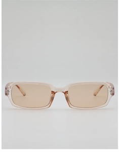 Detail of transparent peach-colored square sunglasses frame with matching tinted lenses