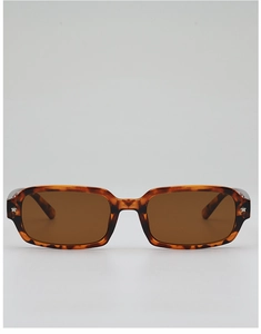 Detail of tortoise shell rectangular sunglasses with star metal accents and brown lenses