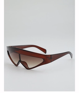 Detail view of large brown gradient lenses and futuristic translucent frame sunglasses