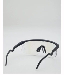 Detail of transparent cycling goggles with matte black frame and geometric temples