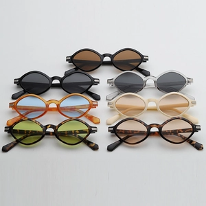 Flat lay of small irregular polygon sunglasses in six assorted colors and lens shades