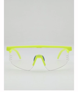 Detail of neon green cycling glasses featuring side ventilation vents and clear lenses