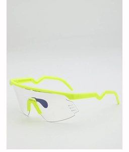 Detail view of fluorescent yellow cycling glasses with integrated vents and side temples