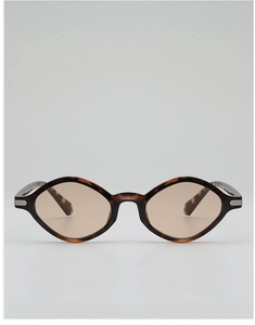 Detail of vintage tortoiseshell geometric sunglasses with silver metal temple accents