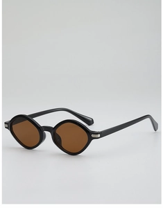 Detailed close-up of retro geometric sunglasses with black frames and brown amber lenses