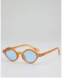 Close-up of amber irregular polygon sunglasses with blue lenses and silver metal trim
